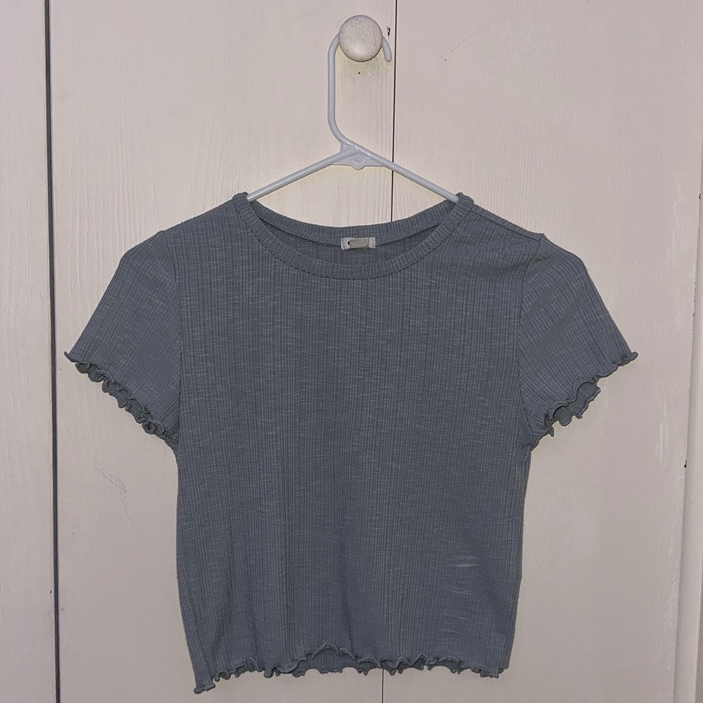 Grey-blue ruffled top. Not cropped. Size small.